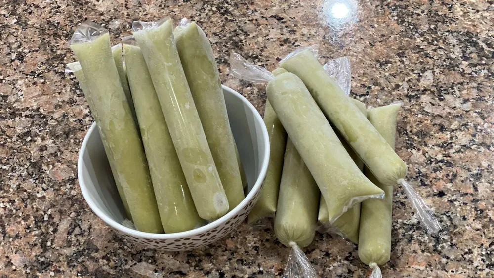 filipino avocado ice candy in wrapper with bowl