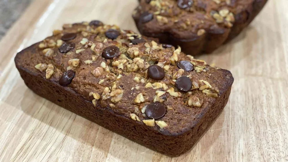 moist banana walnut bread on cutting board