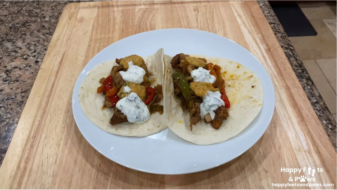 two chicken fajitas on a plate