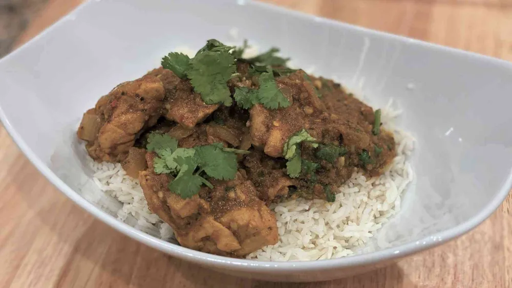 Chicken tikka masala in a bowl with basmati rice