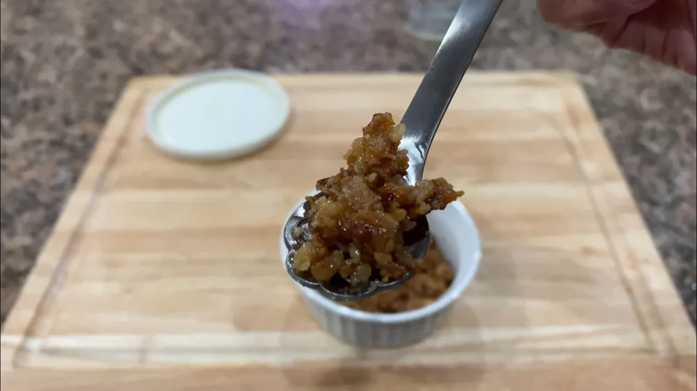 Coconut milk curds on a spoon