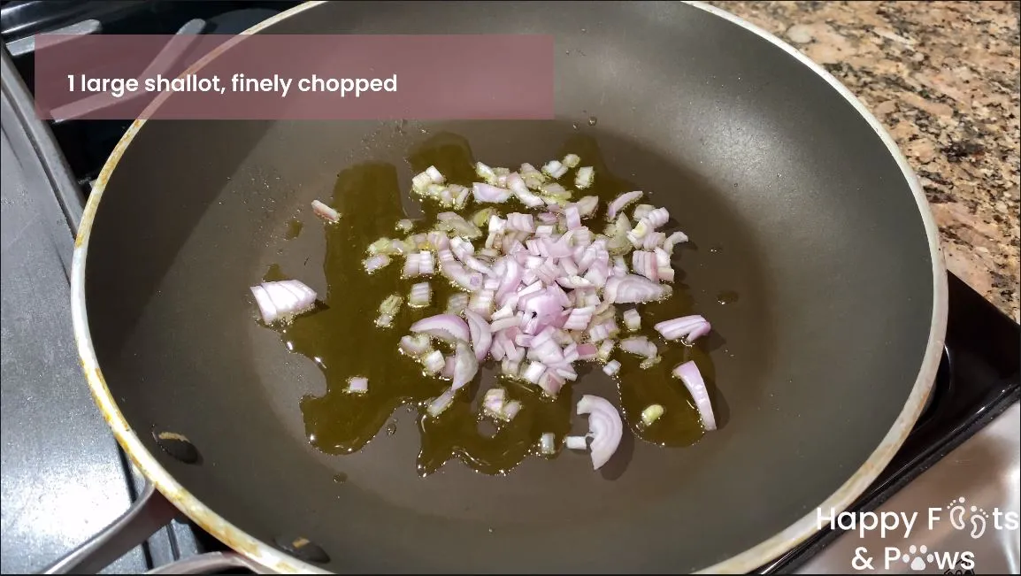 shallots sauteeing on a pan with oil