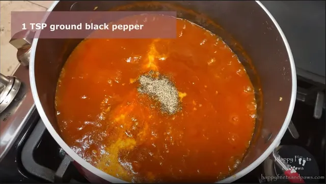 spaghetti sauce being cooked in a large pot