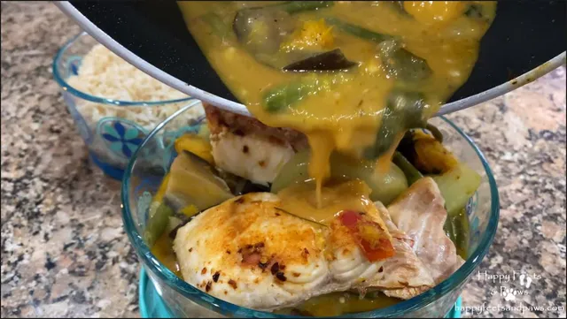 pouring sauce on fish in a bowl