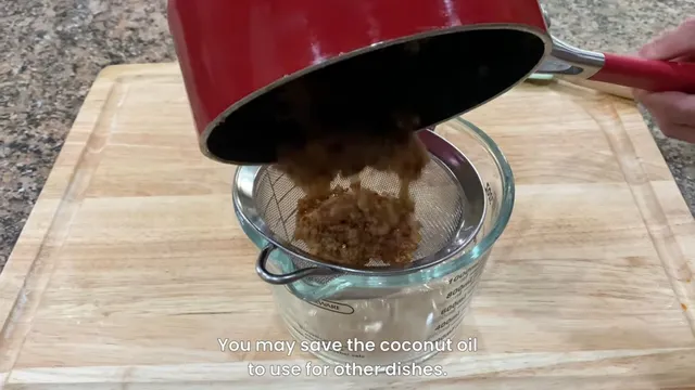 straining coconut milk curds with a screen over a measuring bowl