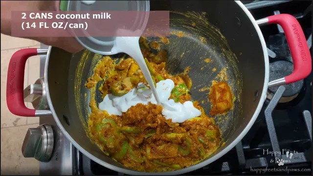 pouring coconut milk into pot for for panang curry recipe