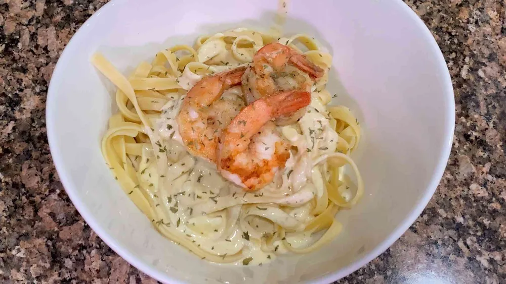 Shrimp Fettuccine Alfredo in a bowl on a counter