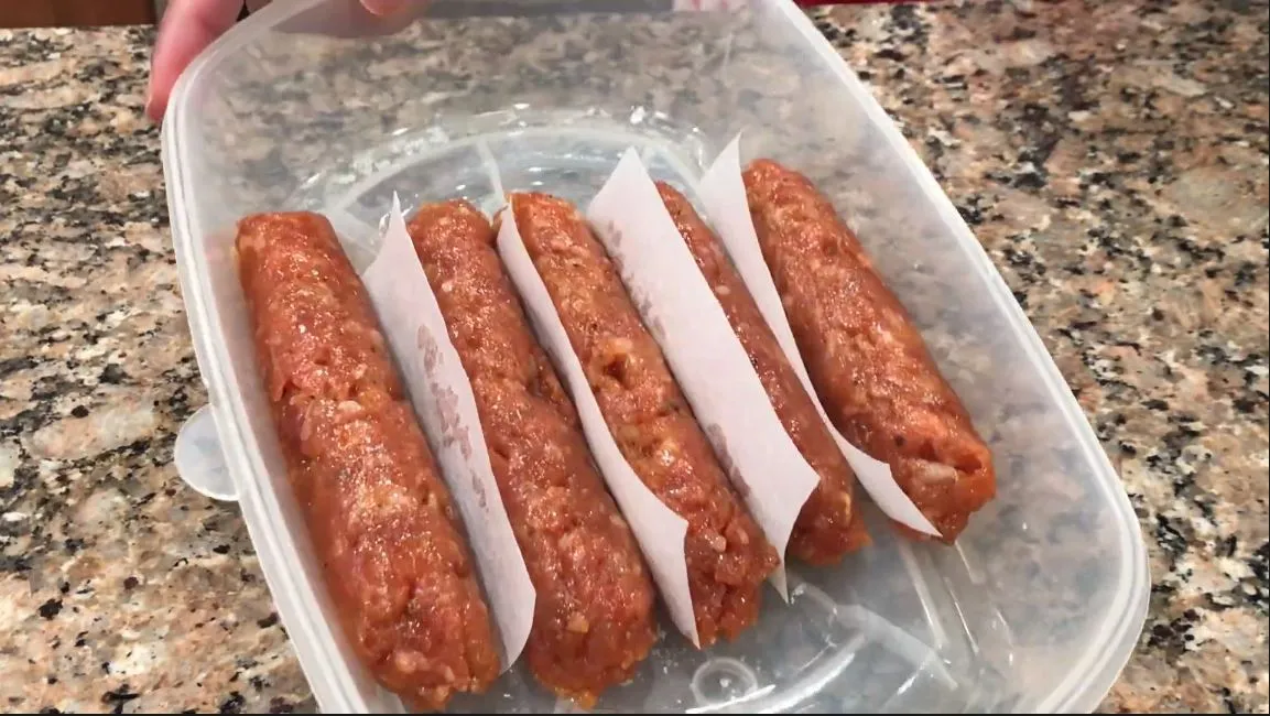 skinless longanisa stored in a container with paper in between