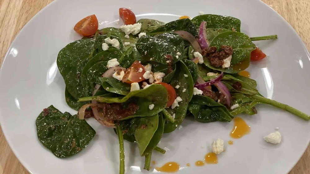 Spinach Salad with feta cheese on a plate