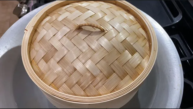 steaming leche flan on a large wok