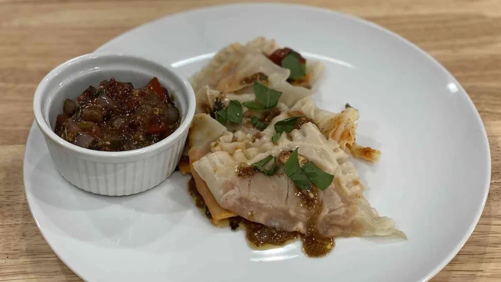 White Bean and Sun-Dried Tomato Ravioli with Tomato and Feta Cheese Sauce on a plate